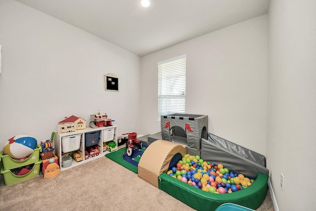 game room with carpet and vaulted ceiling