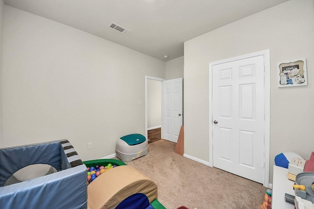 playroom featuring light colored carpet