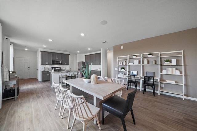 dining room with dark hardwood / wood-style floors