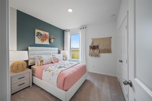 bedroom with light colored carpet