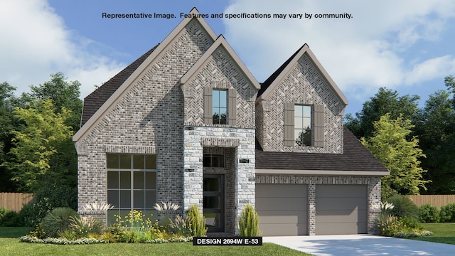 view of front of home featuring a garage and a front lawn