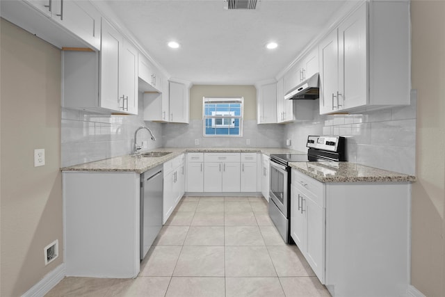 kitchen with white cabinets, light stone countertops, sink, and appliances with stainless steel finishes