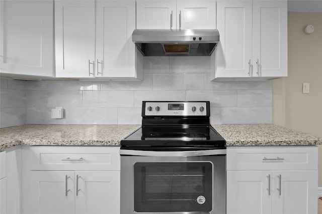 kitchen featuring backsplash, white cabinetry, stainless steel range with electric cooktop, and range hood