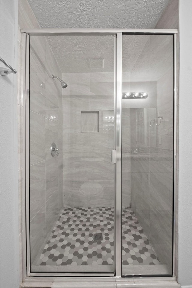 bathroom with an enclosed shower