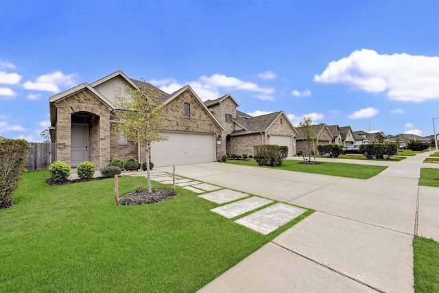 view of front of home featuring a garage and a front yard