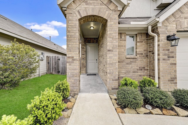 doorway to property featuring a yard