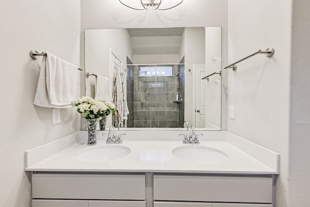 bathroom featuring walk in shower and vanity