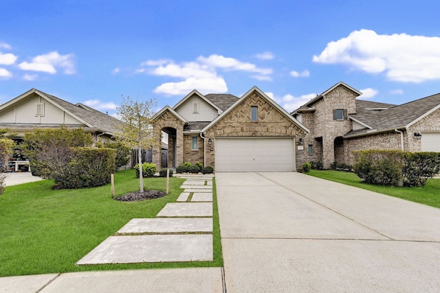 view of front of house featuring a garage and a front yard