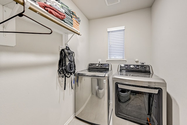 clothes washing area with independent washer and dryer