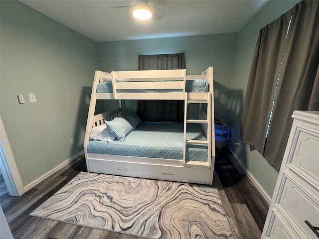 bedroom with ceiling fan and dark hardwood / wood-style flooring