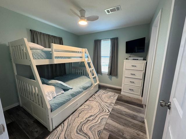 bedroom featuring ceiling fan and dark hardwood / wood-style floors