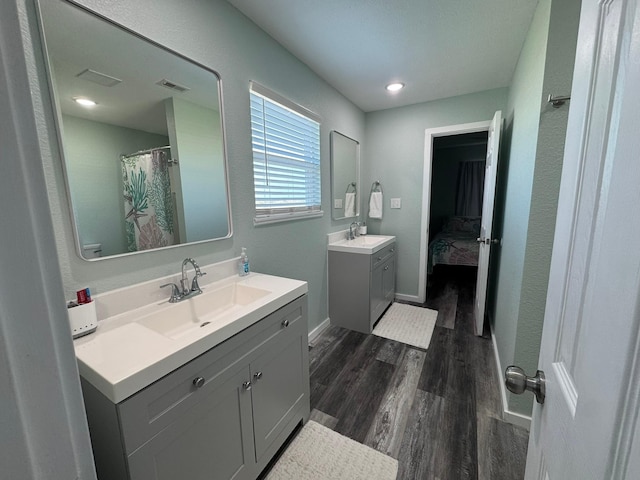 bathroom featuring vanity and hardwood / wood-style floors