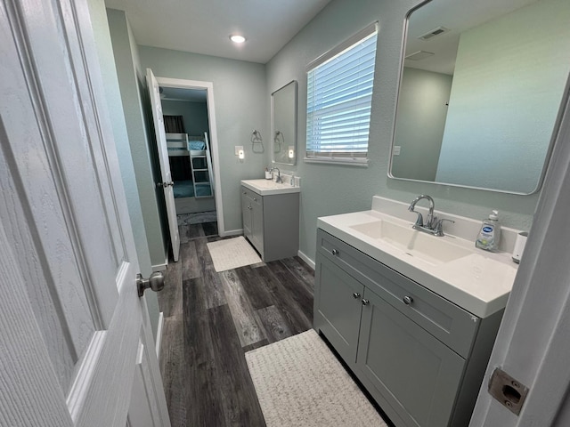 bathroom featuring hardwood / wood-style flooring and vanity