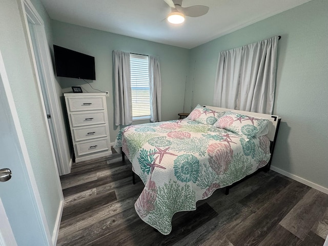 bedroom with ceiling fan and dark hardwood / wood-style flooring