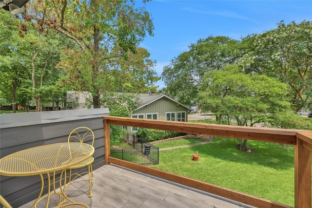 wooden terrace with a yard