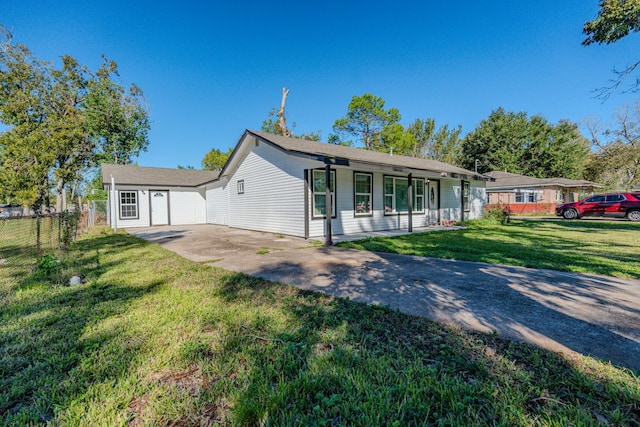 single story home featuring covered porch and a front lawn