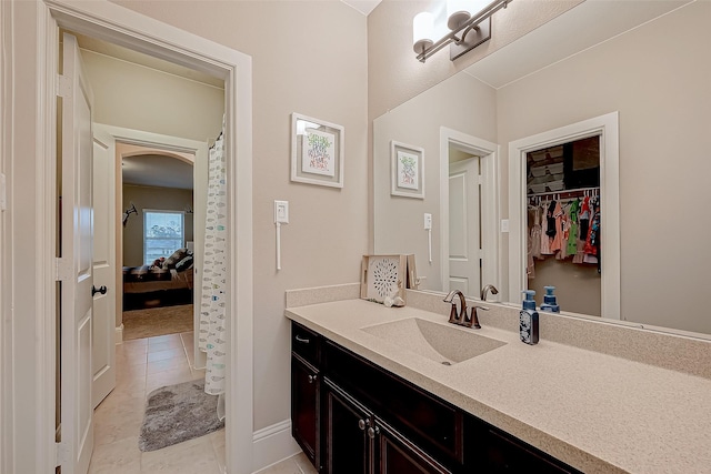 bathroom featuring tile patterned flooring and vanity