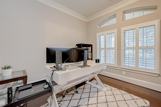 home office with hardwood / wood-style flooring and crown molding