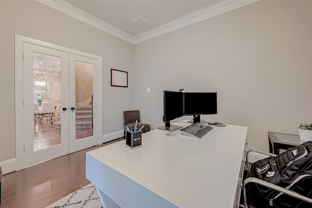 home office featuring light hardwood / wood-style floors, ornamental molding, and french doors