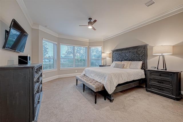 carpeted bedroom featuring ceiling fan and ornamental molding