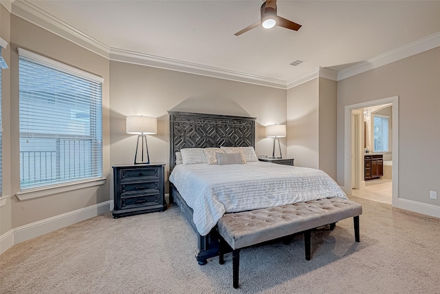 carpeted bedroom with connected bathroom, ceiling fan, and crown molding