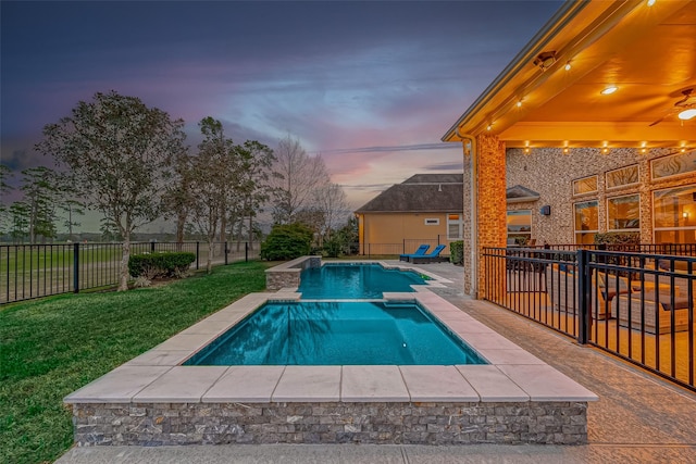 pool at dusk with a yard