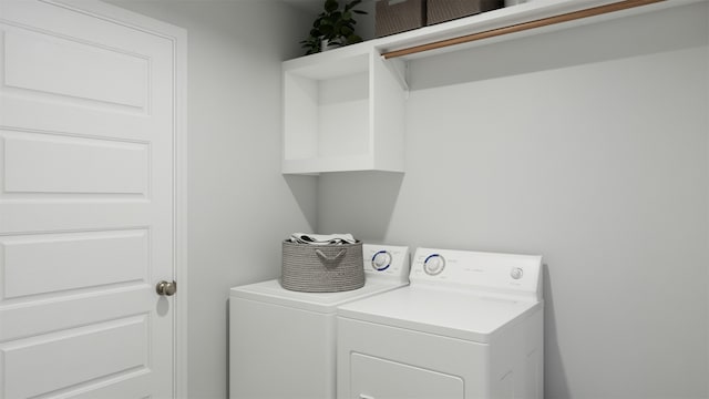 clothes washing area featuring independent washer and dryer