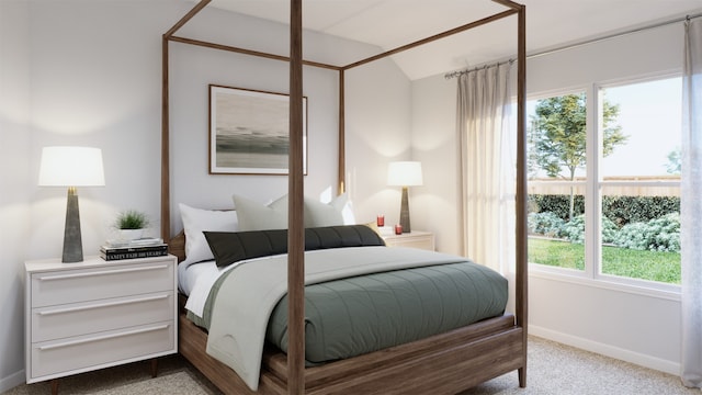 carpeted bedroom featuring lofted ceiling