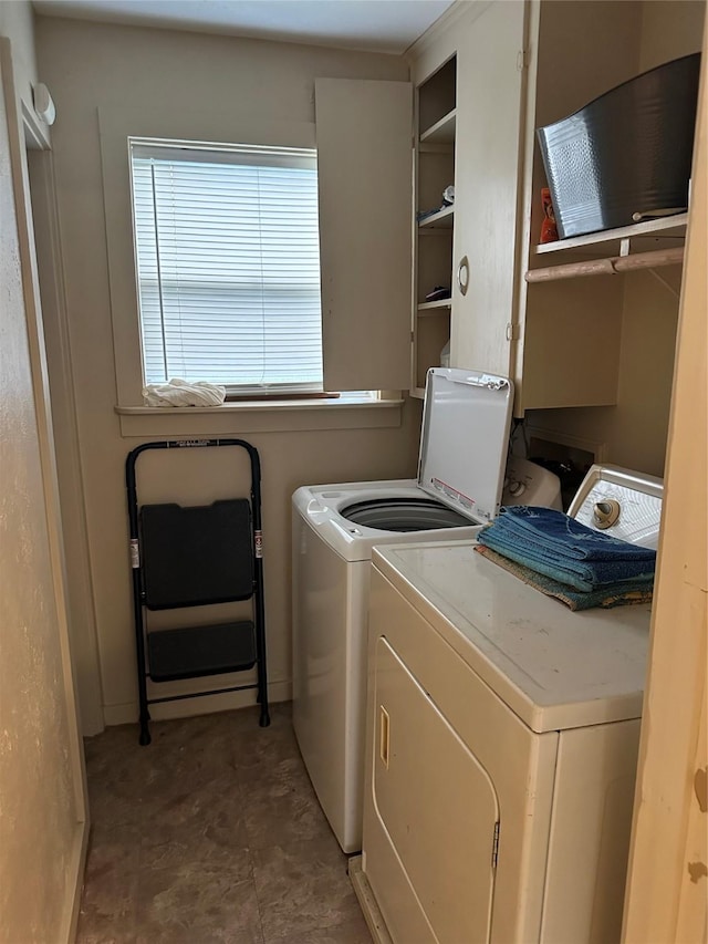 clothes washing area featuring washing machine and dryer