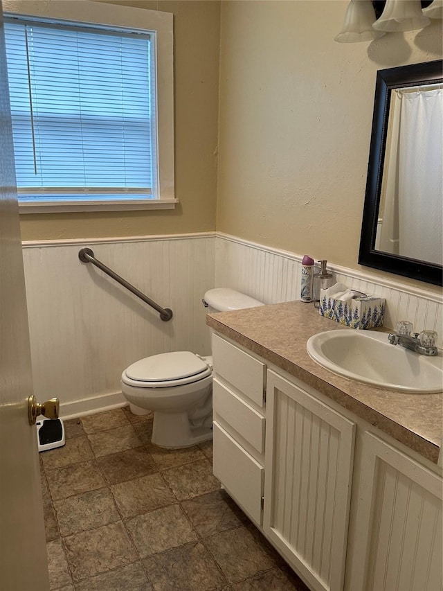 bathroom with toilet and vanity