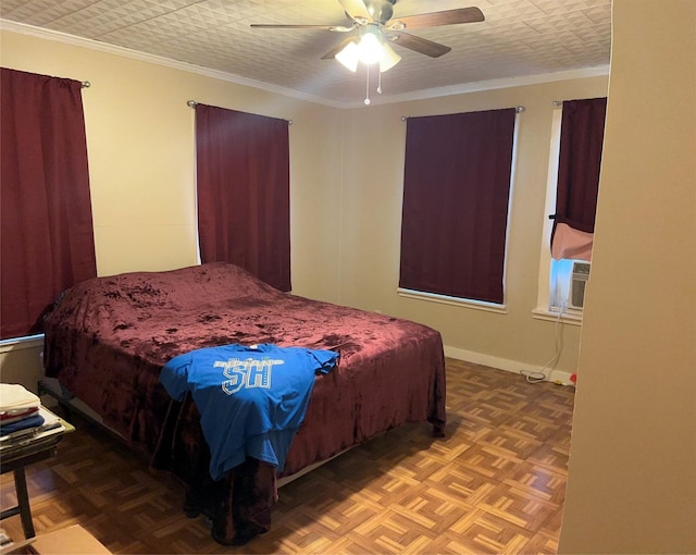 bedroom with ceiling fan, parquet flooring, ornamental molding, and a textured ceiling