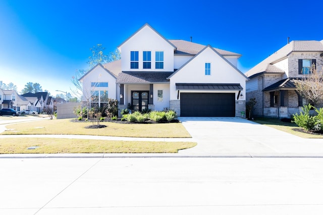 view of front facade with a front lawn and a garage