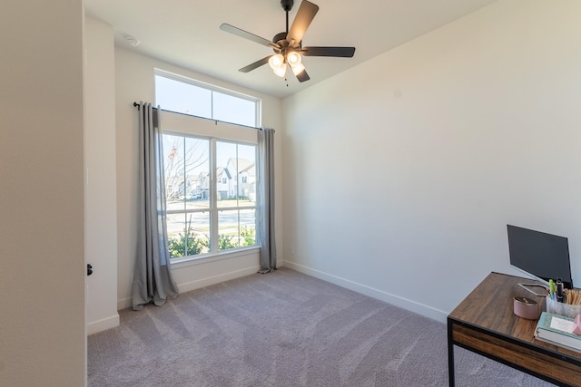 office featuring ceiling fan and light carpet