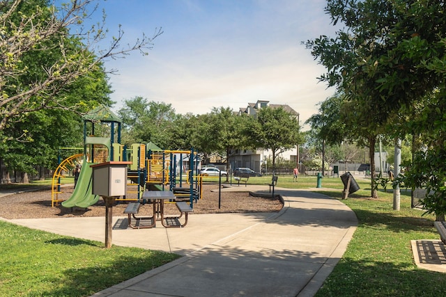 view of jungle gym featuring a lawn