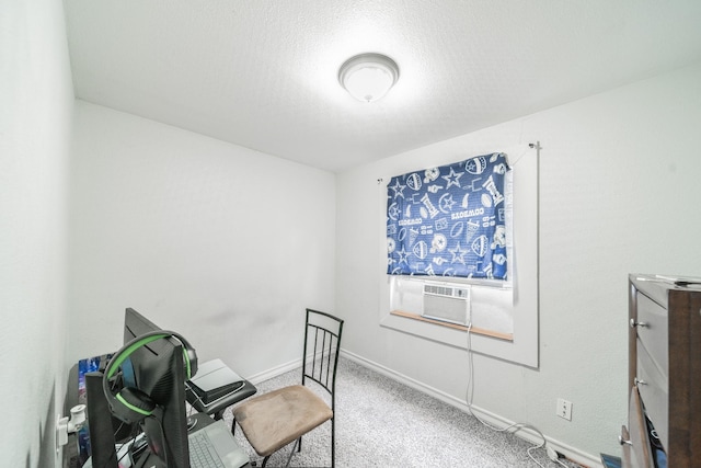 home office featuring carpet flooring, cooling unit, and a textured ceiling