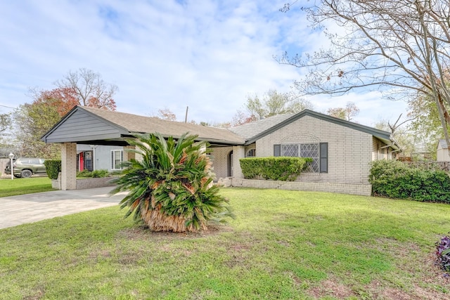 ranch-style house with a carport and a front lawn