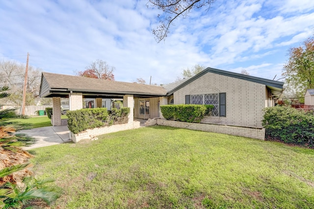 ranch-style home with a front lawn