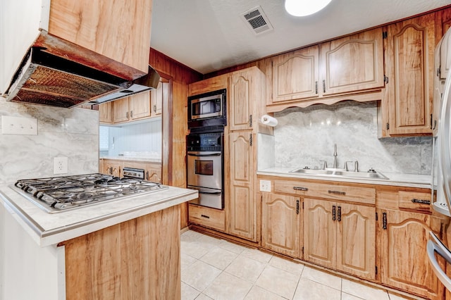 kitchen featuring backsplash, light tile patterned flooring, sink, and stainless steel appliances