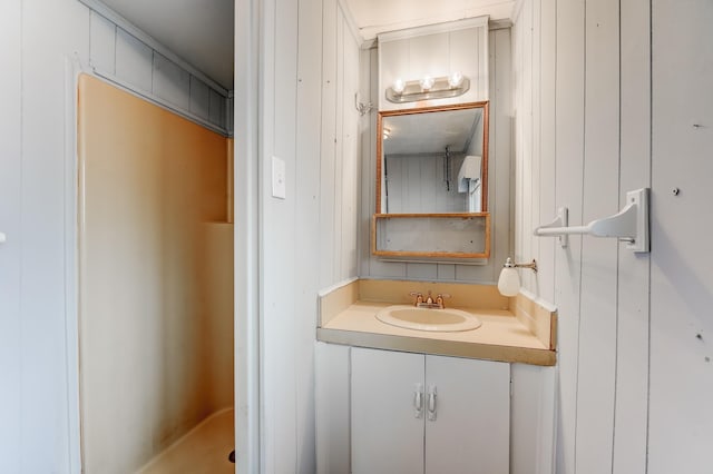 bathroom with vanity and crown molding