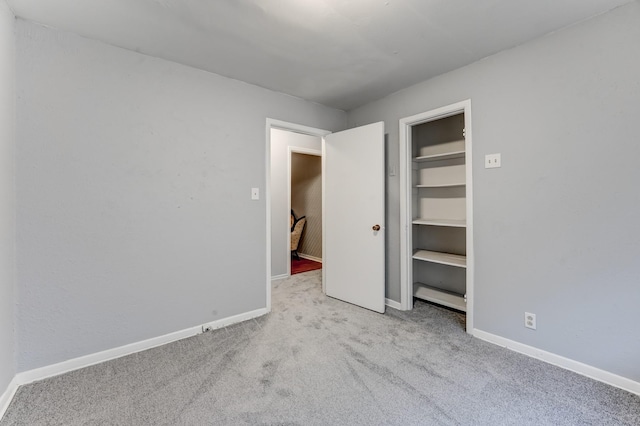 unfurnished bedroom with light carpet