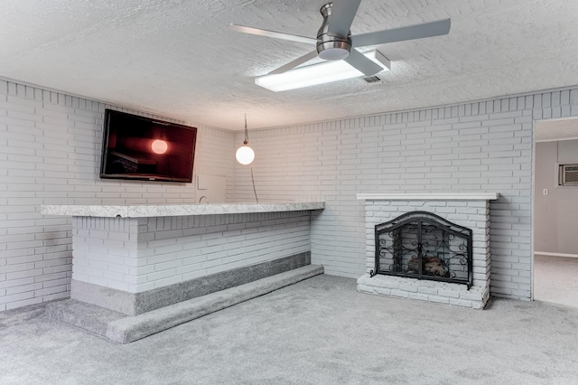 unfurnished living room with a fireplace, carpet, and brick wall