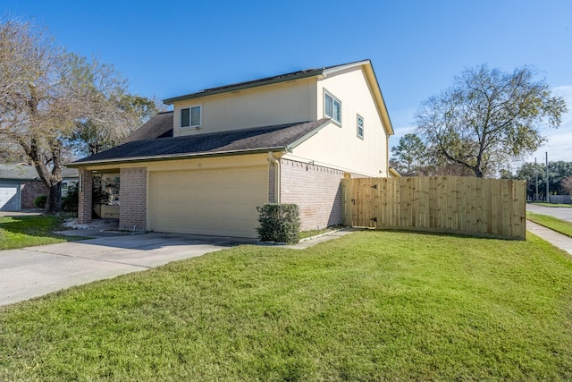 view of side of property with a yard and a garage