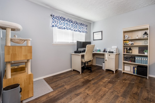 office space with dark hardwood / wood-style floors and a textured ceiling