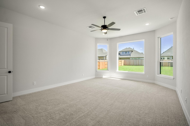 empty room with carpet and ceiling fan