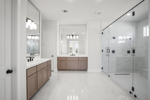 bathroom with vanity, walk in shower, and a wealth of natural light