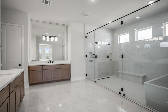 bathroom with plenty of natural light, vanity, and an enclosed shower