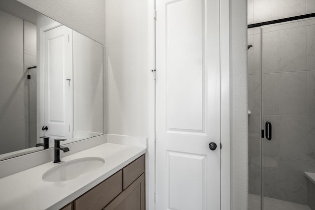 bathroom with vanity and walk in shower