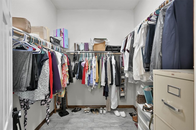 walk in closet featuring light wood-type flooring