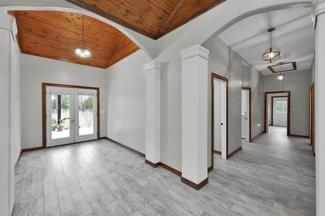 entryway featuring decorative columns, wooden ceiling, high vaulted ceiling, and french doors