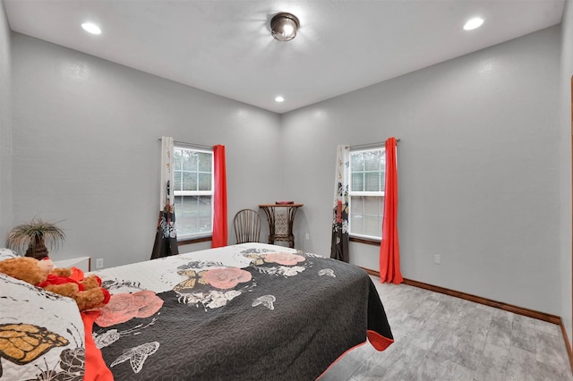 bedroom with multiple windows